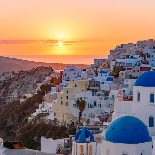 Blue domed churches and traditional white houses facing Aegean S